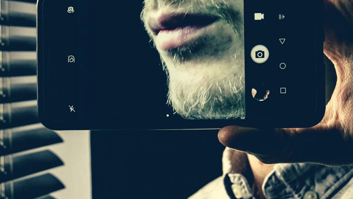 A person editing a photo on a smartphone using an editing app
