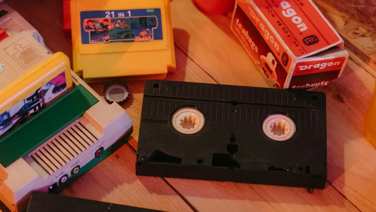 VHS tapes, popcorn and retro drinks laid out for a movie night