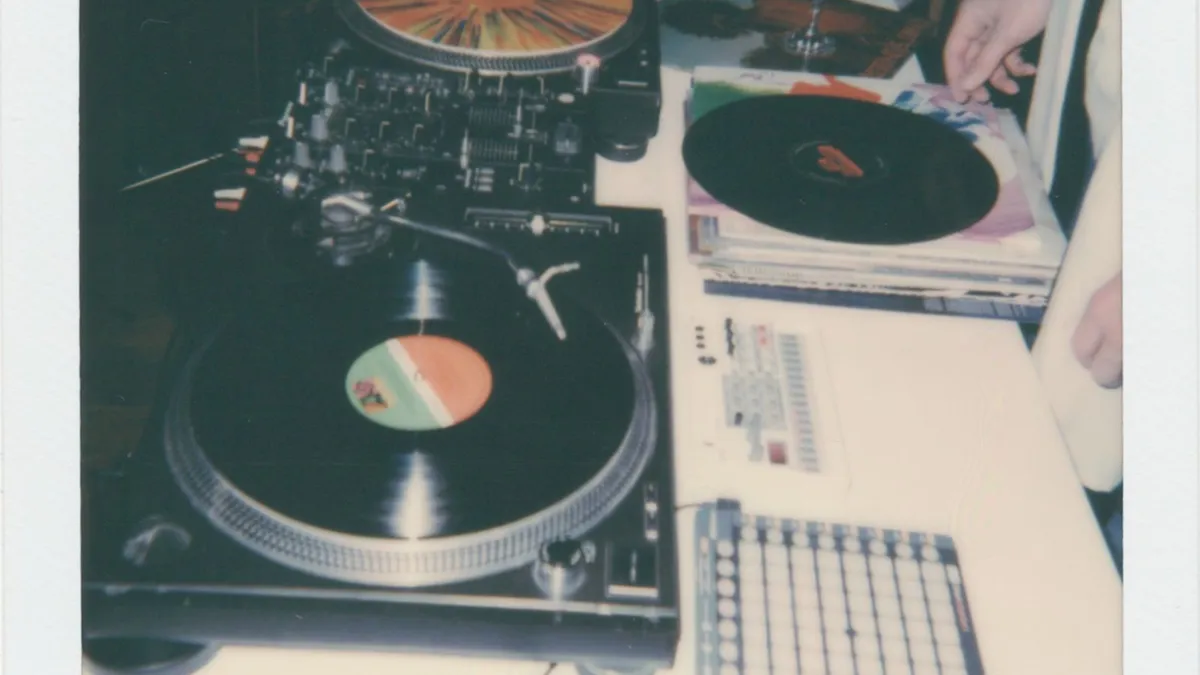 A vintage DJ setup with turntables and vinyl records
