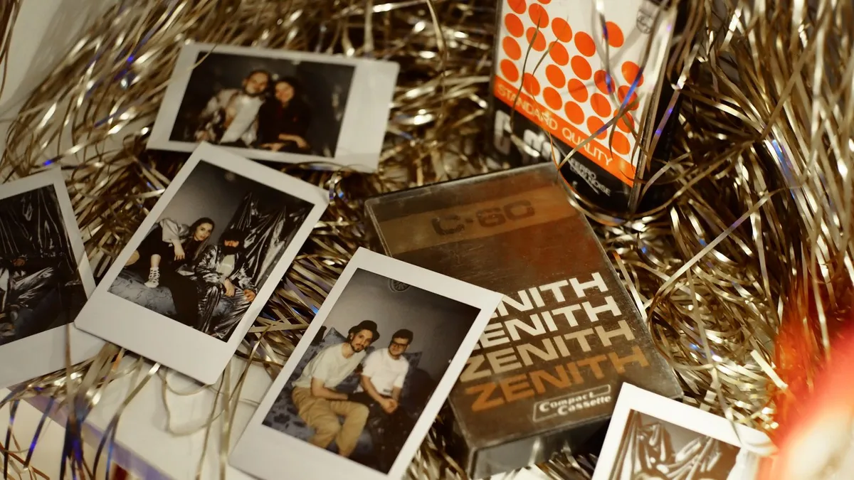 Retro Polaroid photos scattered on a surface with tinsel